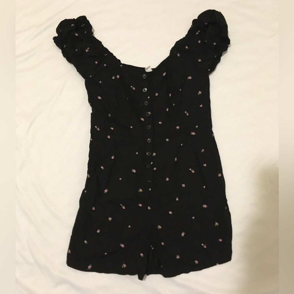 BP Black romper with purple flowers and ruffle sleeves